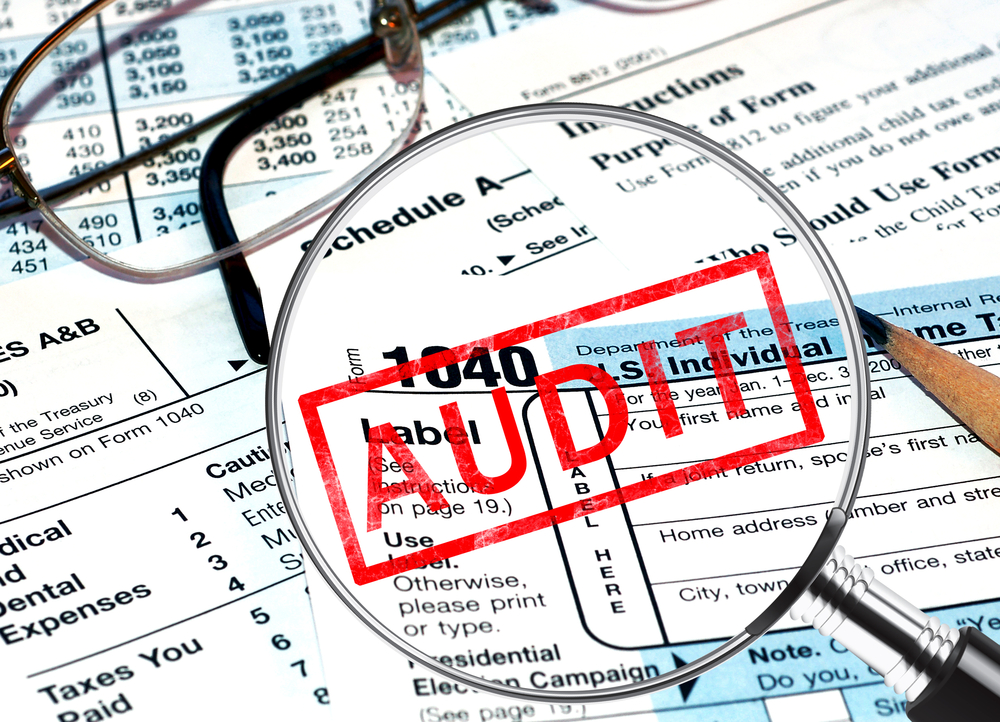 tax forms with an audit stamp